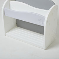 White and grey bookshelf for kids with minimal design and smooth curves.